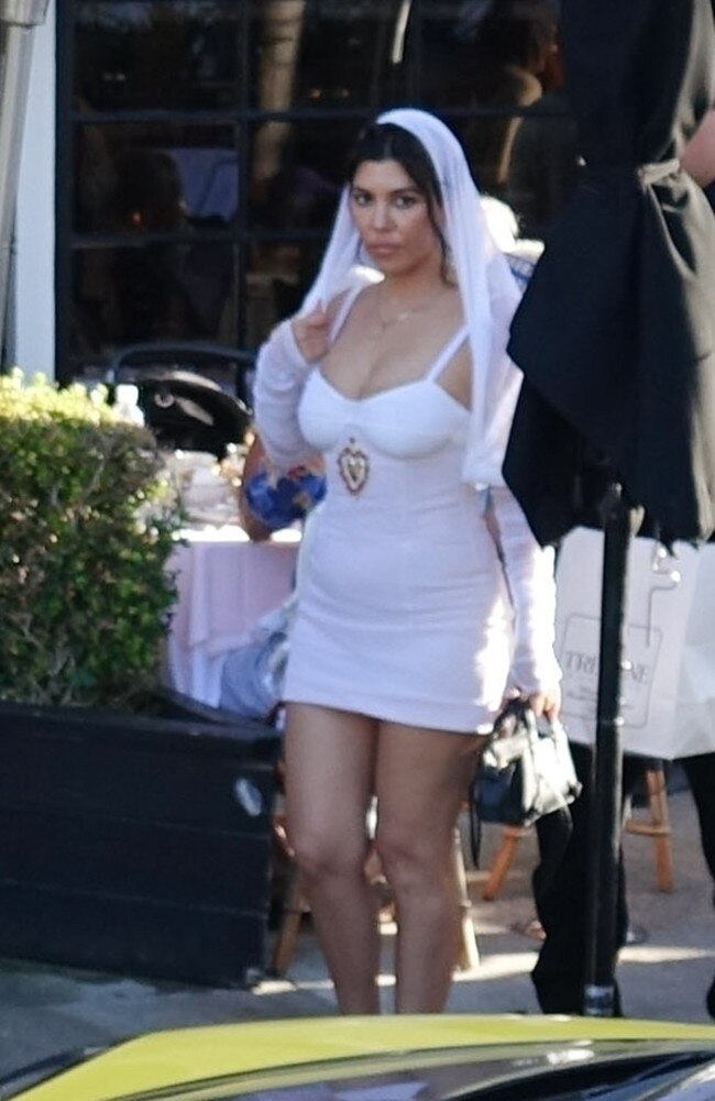 Kourtney Kardashian wore a short white D&amp;G dress. Picture: Clint Brewer Photography/A.I.M/BACKGRID