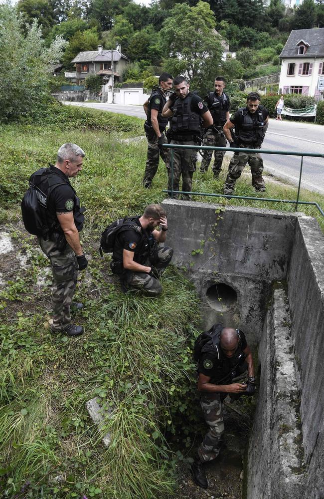 French gendarmes search for evidence in Pont-de-Beauvoisin. Picture: AFP/Philippe Desmazes