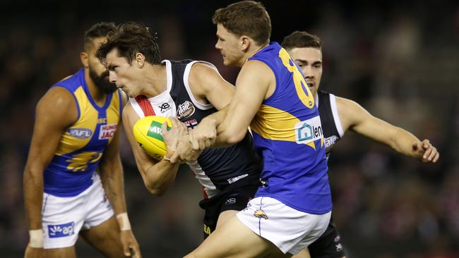 Jack Steele attempts to break free from a Jack Redden tackle earlier this season. Picture: Darrian Traynor/AFL Photos/Getty Images.