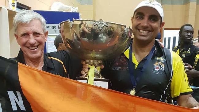 Chris Baksh and 1965 premiership coach Terry Elliott celebrate last year’s Premier League flag. Can he engineer historic back-to-back flags?