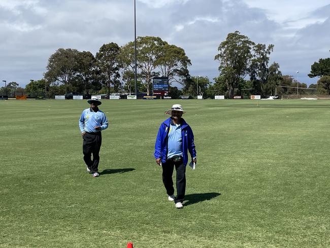 Umpire Cliff D’Souza (right) during his 800th game on Saturday.