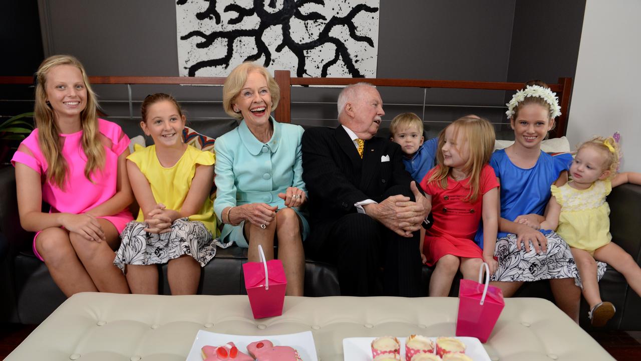 Outgoing Governor General, Dame Quentin Bryce and her husband Michael Bryce are welcomed by their grandchildren in Brisbane in 2014. Picture: AAP Image/Dan Peled