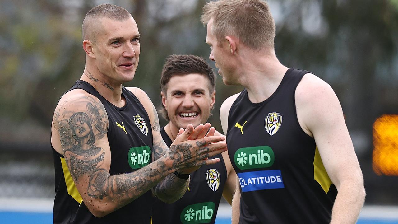 Dustin Martin and Liam Baker have a laugh with Jack Riewoldt during Monday’s training session. Picture: Michael Klein