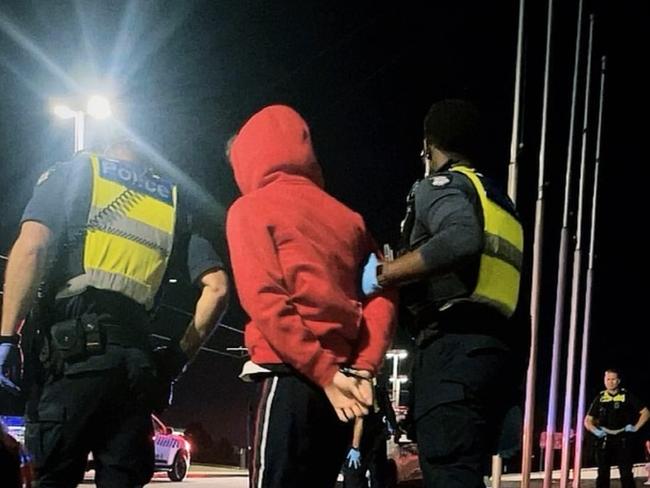 Police detain one of the youths involved in Tuesday night's crime spree. Picture; Supplied