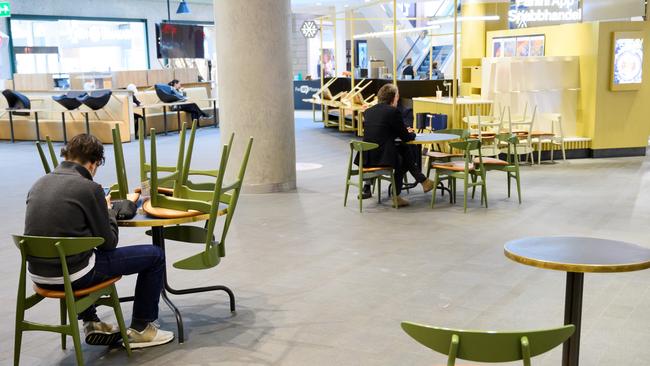 People keeping social distances at a shopping centre in Stokholm. Picture: AFP