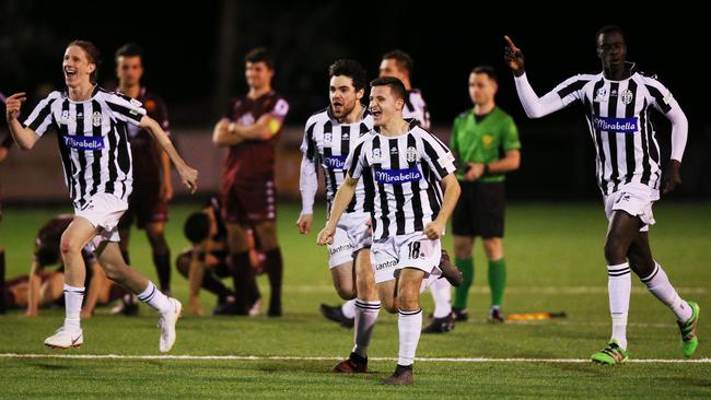 Moreland Zebras player celebrate the penalty shootout win.