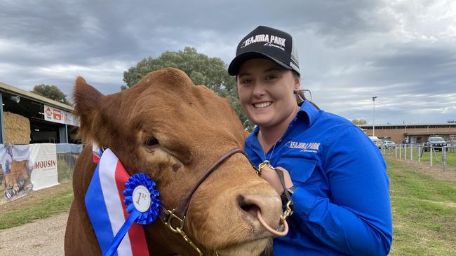 Bek Bayley from Tarcutta, NSW, with Keajura Park Speedloaded S8, the top price bull at the Limousin National Show and Sale at Holbrook, NSW.