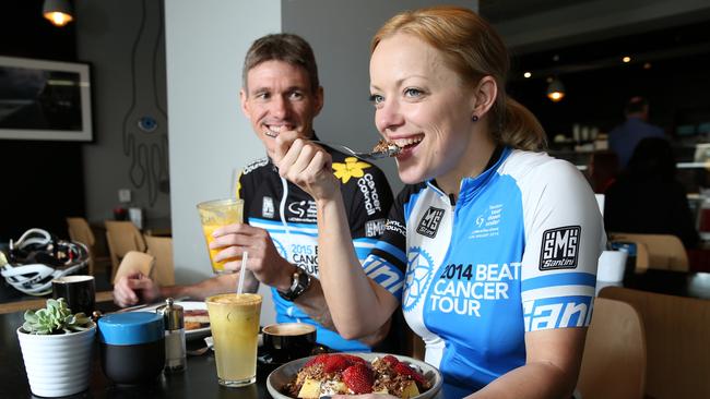 John Cullen and Felicity Lloyd fuel up like the pros do at Argo Cafe in Victoria Square, Adelaide, as they prepare for the Beat Cancer Tour. Picture: Stephen Laffer