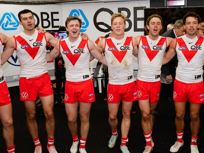 MELBOURNE, AUSTRALIA - AUG 16: The Swans sing the team song during the 2024 AFL Round 23 match between Essendon Bombers and the Sydney Swans at Marvel Stadium on August 16, 2024 in Melbourne, Australia. (Photo by Dylan Burns/AFL Photos via Getty Images)