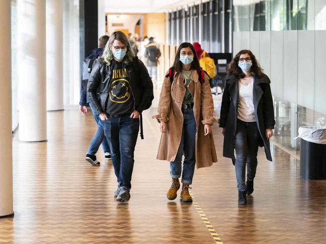 Students wear face masks at the University of Amsterdam due to the tightening of the measures against the coronavirus. Picture: AFP