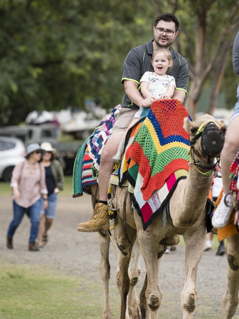 Ivy Rust and dad Michael Rust enjoy a camel ride at the Toowoomba Royal Show, Saturday, April 1, 2023. Picture: Kevin Farmer