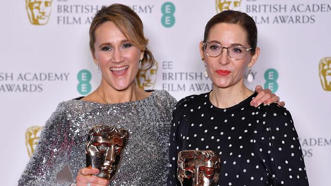 Production designer Fiona Crombie and set decorator Alice Felton pose with their awards for Production Design for their work on the film The Favourite. Picture: AFP