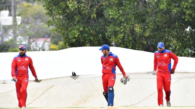 The covers come on the ground because of the rain. Toombul v Wests in first grade Queensland Premier Cricket Saturday September 28, 2024. Picture, John Gass