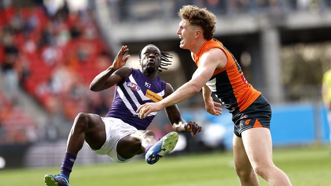 Giants Tom Green tackles Fremantle's Michael Frederick during the AFL Round 23 match between the GWS Giants and Fremantle Dockers at Engie Stadium on August 17, 2024. Photo by Phil Hillyard(Image Supplied for Editorial Use only - **NO ON SALES** - Â©Phil Hillyard )