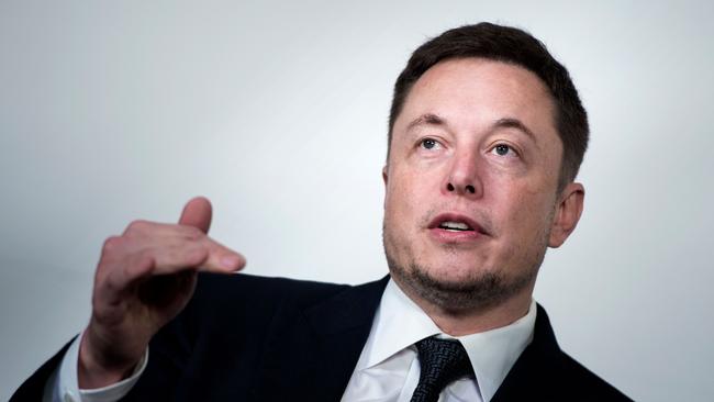 (FILES) In this file photo taken on July 19, 2017, Elon Musk, CEO of SpaceX and Tesla, speaks during the International Space Station Research and Development Conference at the Omni Shoreham Hotel in Washington, DC. American space entrepreneur Elon Musk tweeted that he was in Thailand on Tuesday July 8, 2018, with a prototype mini-sub, at the flooded cave where five members of a youth football team remained trapped. / AFP PHOTO / Brendan Smialowski