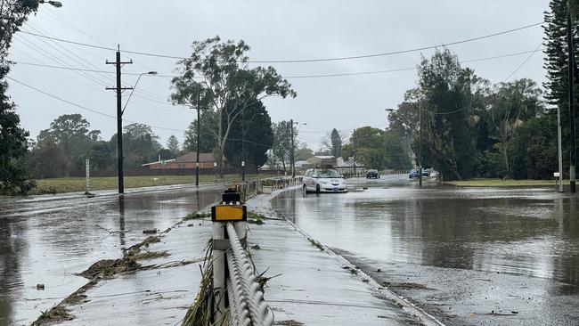 Milperra Rd, and Newbridge Rd, relied upon for evacuations, are highly prone to flooding, making evacuations more challenging for the families who live there. Picture: Paul Brescia