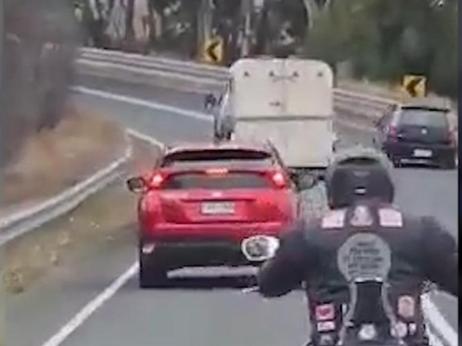 A ‘selfish’ driver has been caught on camera crossing double white lines on a blind corner to overtake two cars and a horse float in the Adelaide Hills. Picture 7NEWS