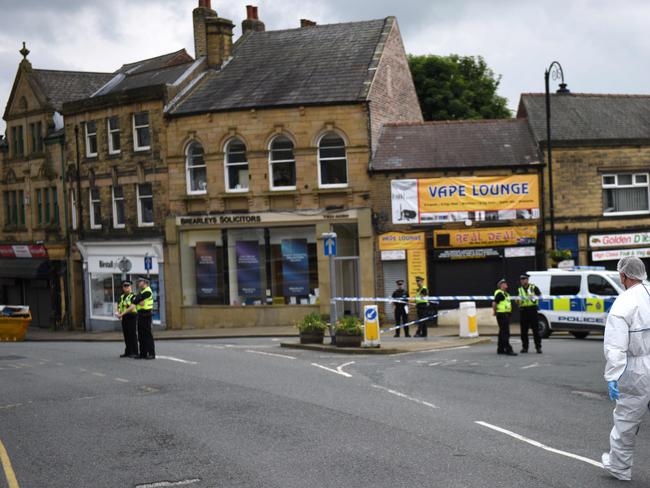 A police forensic officer prepares to work at the scene in Birstall where Labour MP Jo Cox was shot on June 16, 2016. Picture: AFP.