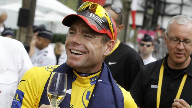 Evans toasts his Tour de France victory along the Champs Elysees. Picture: AP Photo/Laurent Cipriani