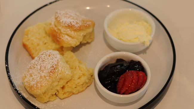 Homemade scones served with jam and cream.