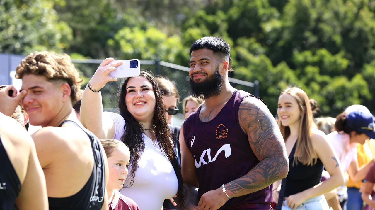 A Broncos fan gets a selfie with prop Payne Haas at last week’s captains run. Picture: Adam Head