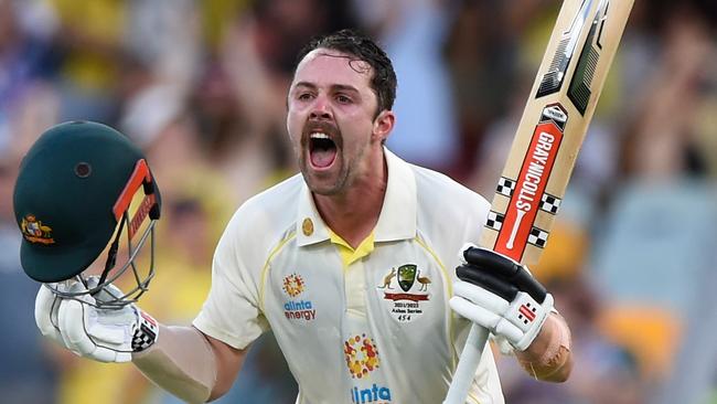 Travis Head celebrates his century during day two of the first Test in the Ashes series at the Gabba in Brisbane on Thursday. Picture: Getty Images