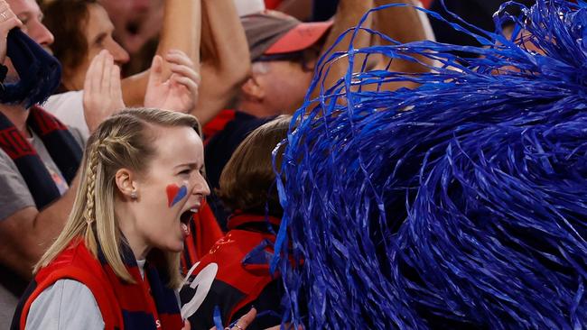 Demons fans raise their voice during the 2021 grand final.