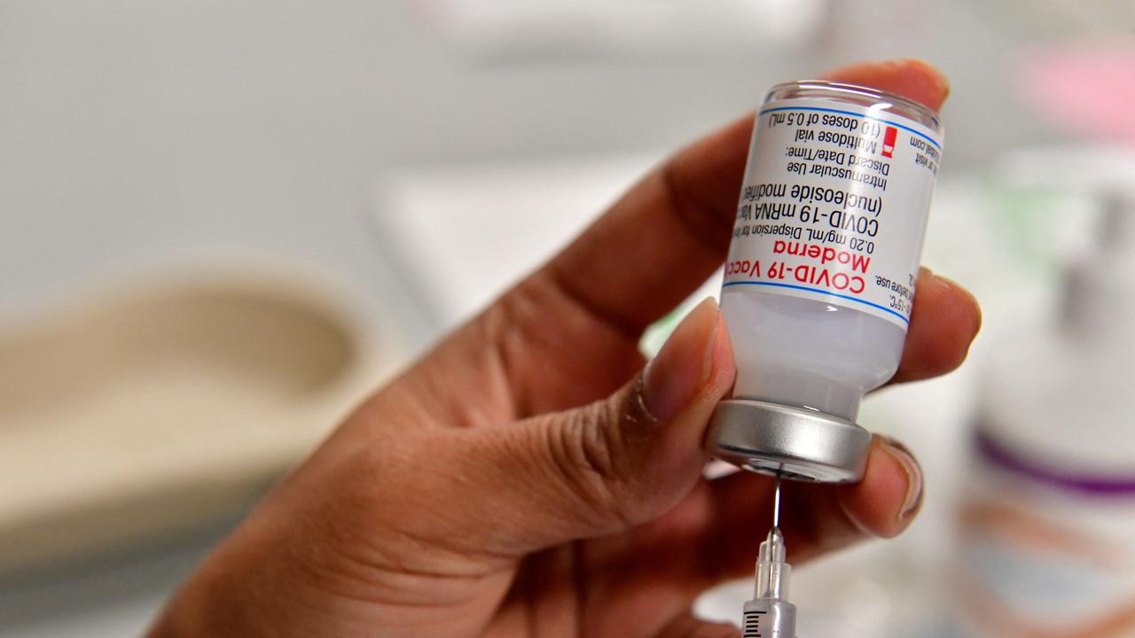 Health worker prepares a dose of Moderna Covid-19 booster vaccine. Picture: AFP.