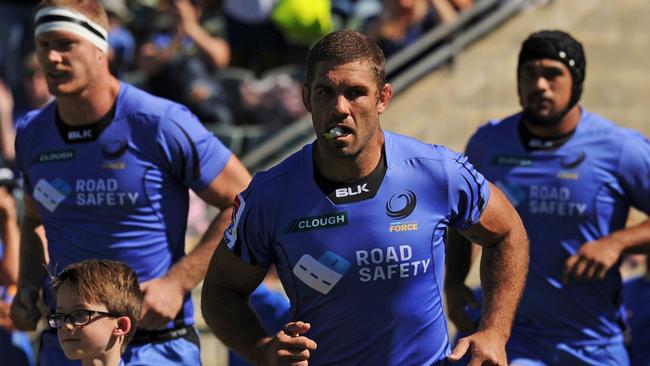 Matt Hodgson leads the Force onto the field to play the Kings.