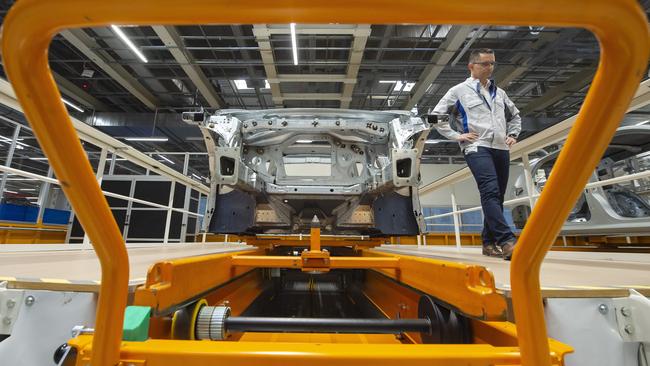 VW’s head of body construction, Heiko Roesch, with the body of the new electric 'ID.3' car at its plant at Zwickau in Germany. Picture: AP