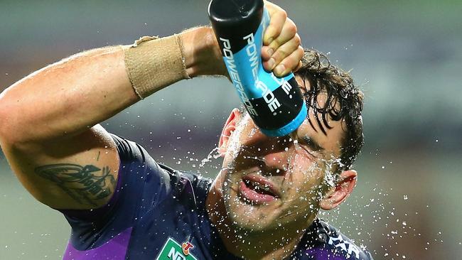MELBOURNE, AUSTRALIA - MARCH 07: Billy Slater of the Storm sprays himself with water during the round one NRL match between the Melbourne Storm and the St George Illawarra Dragons at AAMI Park on March 7, 2016 in Melbourne, Australia. (Photo by Quinn Rooney/Getty Images)