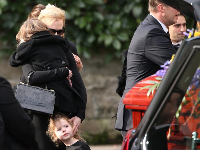 Nicole Kidman shares a moment with her children after the coffin was brought out for the Antony Kidman Funeral at St Francis Xavier Catholic Church, Lavender Bay. Picture: Adam Taylor