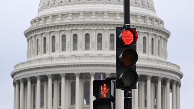 A stoplight is seen in front of the dome of the US Capitol. Picture: AFP