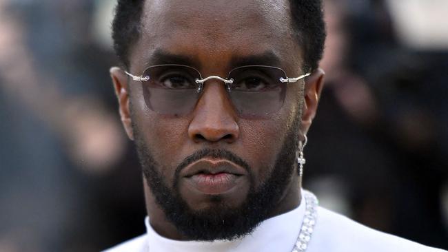 (FILES) Sean Combs 'P. Diddy' arrives for the 2018 Met Gala on May 7, 2018, at the Metropolitan Museum of Art in New York. Music mogul Sean Combs is set to go on trial for racketeering and sex trafficking on May 5, 2025, a judge said in a court hearing October 10, 2024. The rapper known as "Diddy" will remain incarcerated, said federal judge Arun Subramanian, after he was indicted last month on three criminal counts that allege he sexually abused women and coerced them into drug-fueled sex parties using threats and violence. (Photo by ANGELA WEISS / AFP)