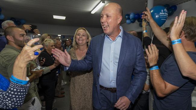 Peter Dutton arrives with his wife Kirilly to celebrate his win in Dickson on Saturday night. Picture: AAP