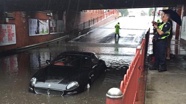 A Maserati stuck in flood waters in Melbourne on Saturday.