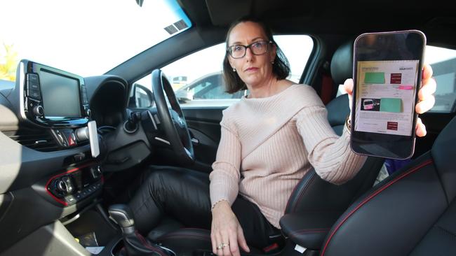 Nicole Walters was fined $167 for angle parking at Helensvale Farmers market after being snapped by a Park Safe vehicle. Picture: Glenn Hampson.