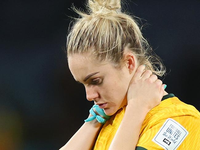 SYDNEY, AUSTRALIA - AUGUST 16: Teagan Micah and Ellie Carpenter of Australia look dejected after the team's 1-3 defeat following the FIFA Women's World Cup Australia & New Zealand 2023 Semi Final match between Australia and England at Stadium Australia on August 16, 2023 in Sydney, Australia. (Photo by Catherine Ivill/Getty Images)