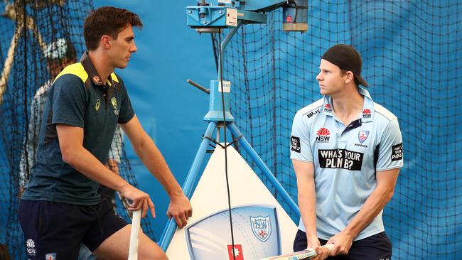 Pat Cummins speaks to Steve Smith at NSW training on Thursday. (Photo by Cameron Spencer/Getty Images)