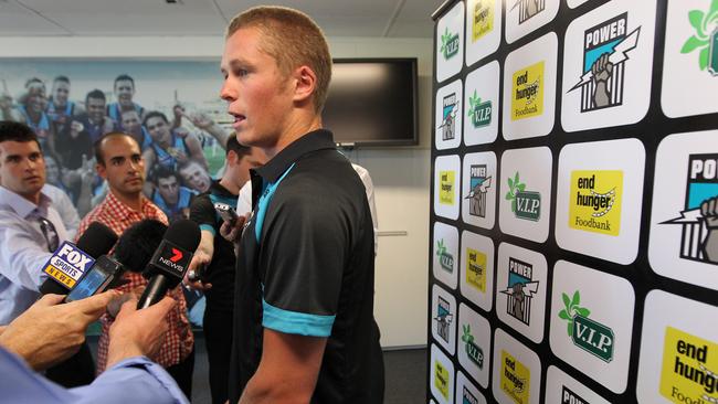 Fronting the media after he was drafted to Port Adelaide in 2012.