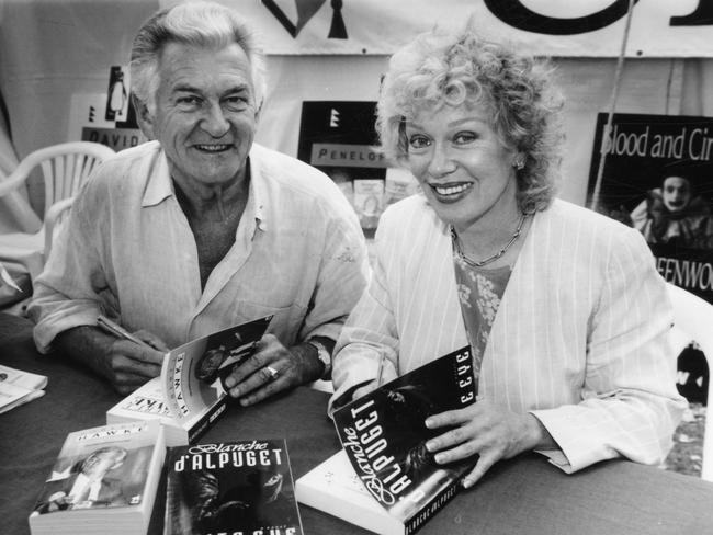 Writers' Week during Adelaide Festival of Arts, 1994. Former Prime Minister Bob Hawke (l) sitting alongside his wife Blanche d'Alpuget as she signs copies of her book "White Eye".