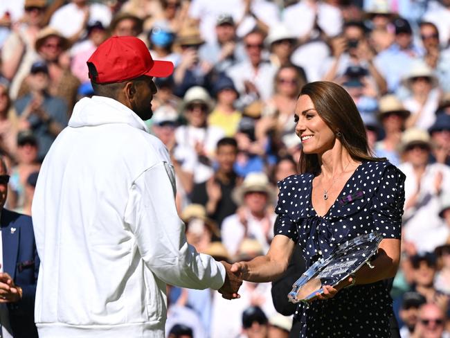 Australia's Nick Kyrgios receives the runner-up's trophy from Britain's Catherine, Duchess of Cambridge, after being defeated by Serbia's Novak Djokovic during their men's singles final tennis match on the fourteenth day of the 2022 Wimbledon Championships at The All England Tennis Club in Wimbledon, southwest London, on July 10, 2022. (Photo by SEBASTIEN BOZON / AFP) / RESTRICTED TO EDITORIAL USE