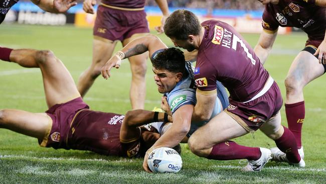 Latrell Mitchell scrapes through to score on his Origin debut. (Michael Klein)