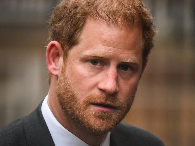 (FILES) Britain's Prince Harry, Duke of Sussex arrives at the Royal Courts of Justice, Britain's High Court, in central London on March 28, 2023. Lawyers for Prince Harry on December 5 began a legal challenge over his security arrangements in the UK, after he quit frontline royal duties and moved to North America.  The case about his loss of UK taxpayer-funded protection is the latest in a string of court proceedings initiated by Harry, whose father is King Charles III. (Photo by Daniel LEAL / AFP)