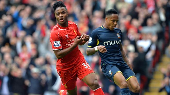 Liverpool's English midfielder Raheem Sterling celebrates scoring the opening goal.