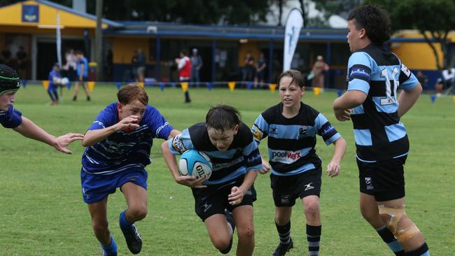 Day 1 of the King of the Country junior rugby union tournament at the Gold Coast Eagles Rugby Union Club.Maroochydore Swans (BLUE AND BLACK) vs USQ Saints (Blue ) Maroochydore Player No USQ Player No Pic Mike Batterham