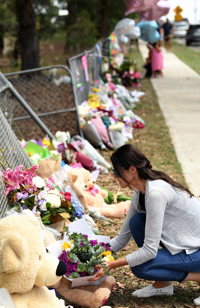 As the day progressed, flowers, toys, ballons and cards stretched up the road. Picture: Joel Carrett/AAP