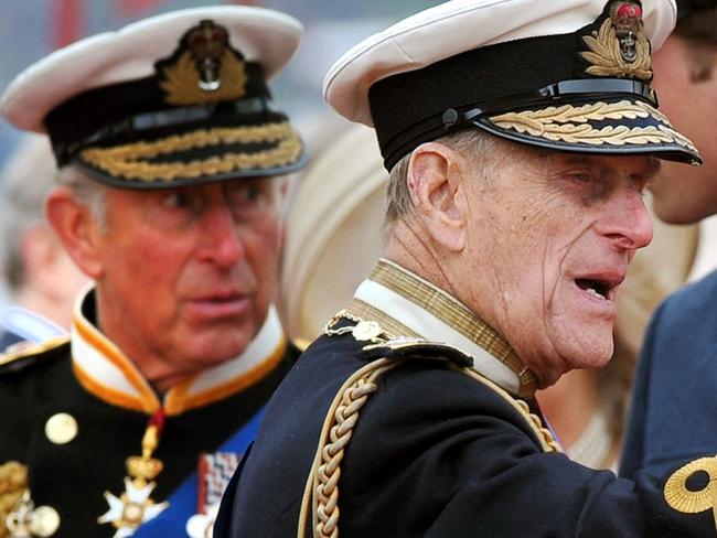 (FILES) In this file photo taken on June 03, 2012 Members of the Royal family (from left to right) Prince Charles, Prince of Wales, Prince Philip, Duke of Edinburgh, Prince William and Prince Harry talk onboard the Spirit of Chartwell during the Thames Diamond Jubilee Pageant on the River Thames in London. - Queen Elizabeth II's 99-year-old husband Prince Philip, who was recently hospitalised and underwent a successful heart procedure, died on April 9, 2021, Buckingham Palace announced. (Photo by JOHN STILLWELL / POOL / AFP)