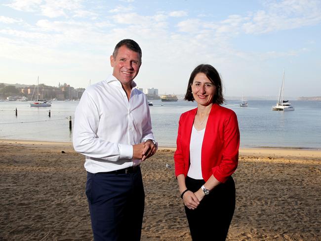 Ms Berejiklian in Manly with former premier Mike Baird. The Premier has gone silent on her football ground.