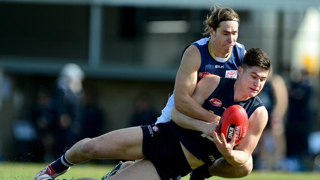 Sam Pfeiffer lays a tackle for the Crows. Picture: Mark Brake